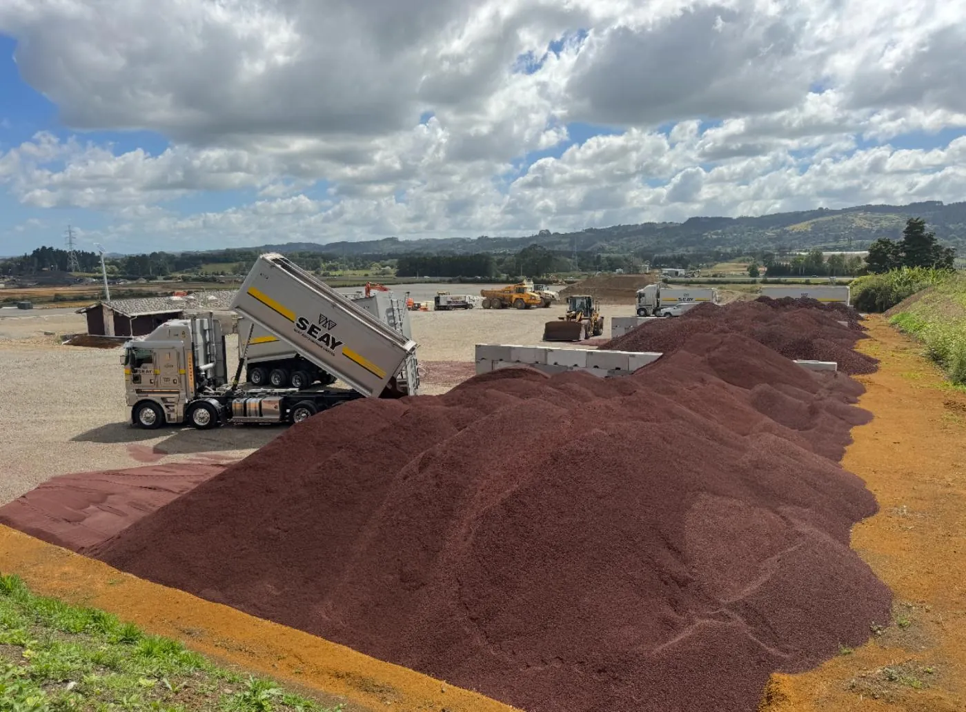 Seay Distribution truck tipping scoria onto a stockpile
